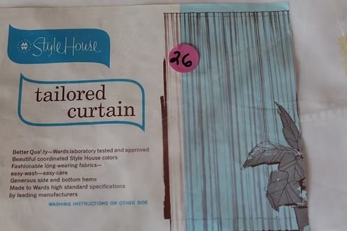 Blue and white tailored curtain packaging with a butterfly design and pink price sticker