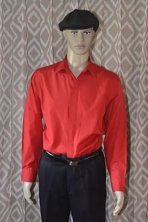 Mannequin wearing a red button-up shirt, black beret, and dark trousers against a patterned backdrop