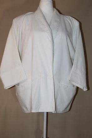 White long-sleeve robe jacket on a mannequin against a plain beige background