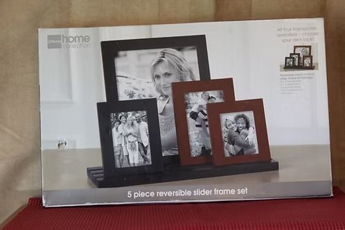 Box of 6-piece faux leather photo frames in black and brown on a red surface