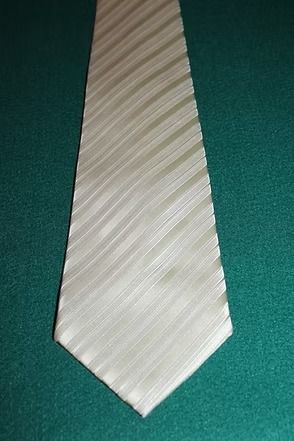 White striped necktie on a dark green background