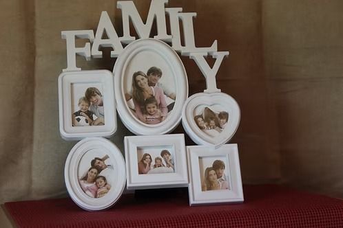 White family photo collage frame with “FAMILY” letters on a red surface
