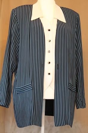 Navy pinstripe blazer over a white collared shirt on a hanger, front view