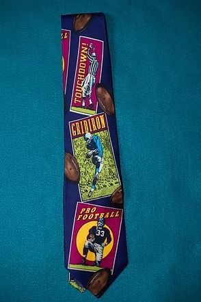 Vertical strip of colorful foil wrappers featuring football-themed chocolate bars on a blue background