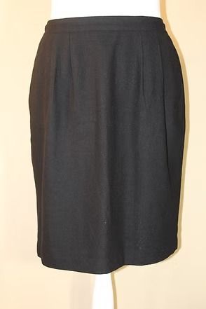 Dark charcoal knee-length skirt with a straight cut and subtle pleats at the waist.