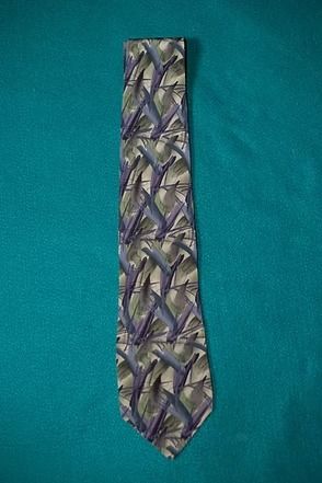 Patterned necktie on a teal background