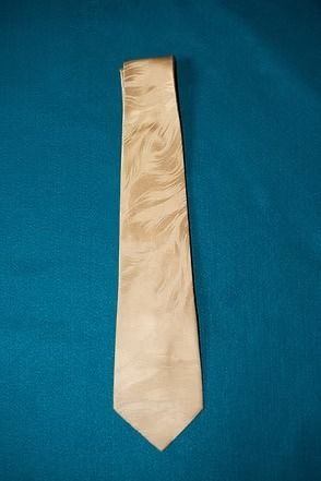 Beige necktie on a blue background