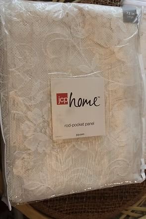Packaged white lace rod pocket panel curtain with “ice home” label