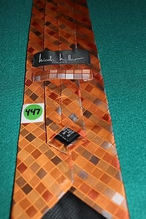 Orange checkered necktie on a teal background