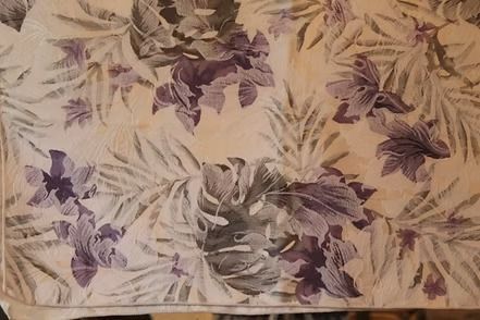 Purple and beige floral wallpaper with leafy patterns on a light background