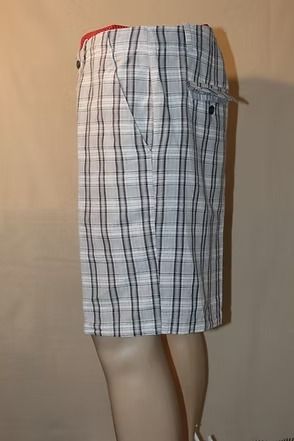 Plaid knee-length shorts displayed on a mannequin, with pockets and belt loops