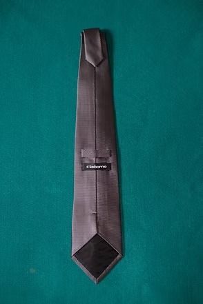 Gray striped necktie on a teal background