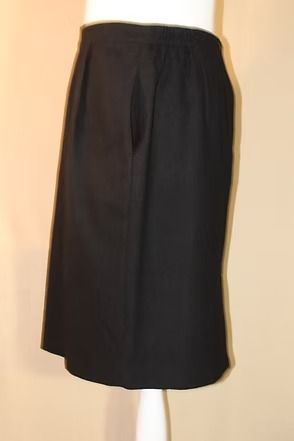 Dark charcoal knee-length skirt with a straight cut and subtle pleats at the waist.