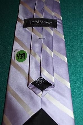Light purple striped necktie on a green textured background