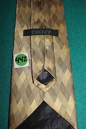 Brown patterned necktie on a teal background