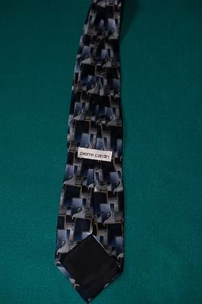 Patterned necktie on a green background