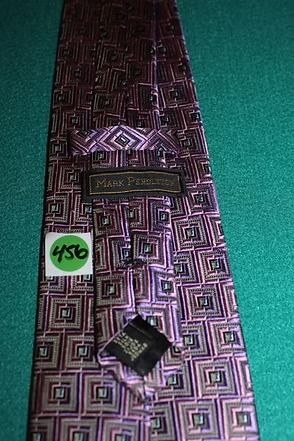A patterned purple tie with pink and black geometric designs on a teal background