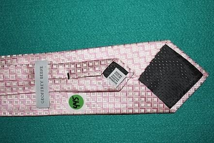 Pink checkered fabric strip on green background