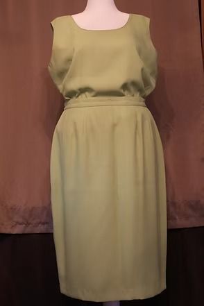 Olive-green sleeveless dress with a gathered waist, displayed on a mannequin.