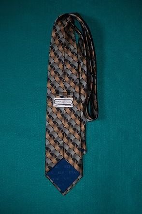 Patterned necktie on a teal background