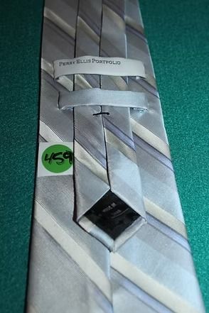Gray and white striped necktie on a teal textured background