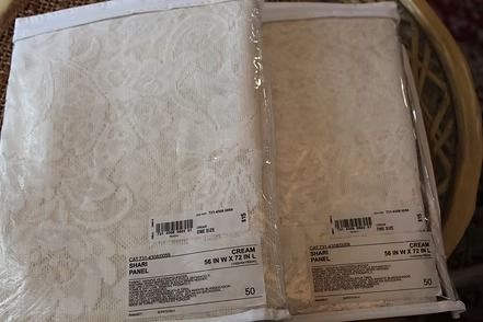 Packaged white lace rod pocket panel curtain with “ice home” label
