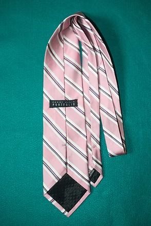 Pink striped necktie on a teal background
