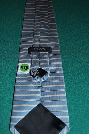 Blue striped necktie on a green surface
