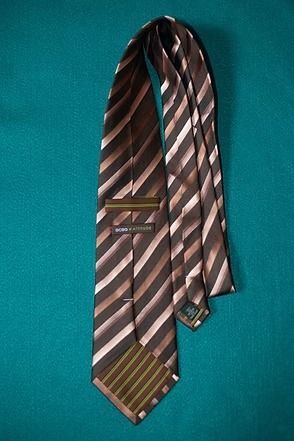 Brown striped necktie on a teal background