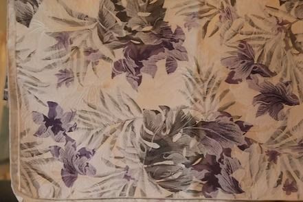 Purple and beige floral wallpaper with leafy patterns on a light background