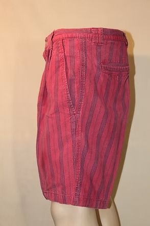 Red striped shorts on a mannequin against a beige background