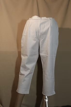White pants shown in side view against a plain brown background.
