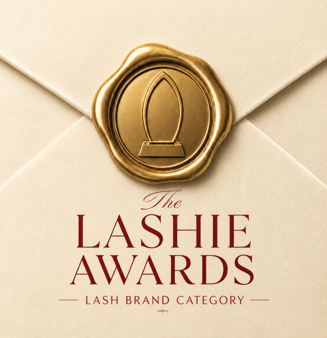 Gold “The Lashie Awards” logo on a cream envelope-style background, with “Lash Brand Category” text.