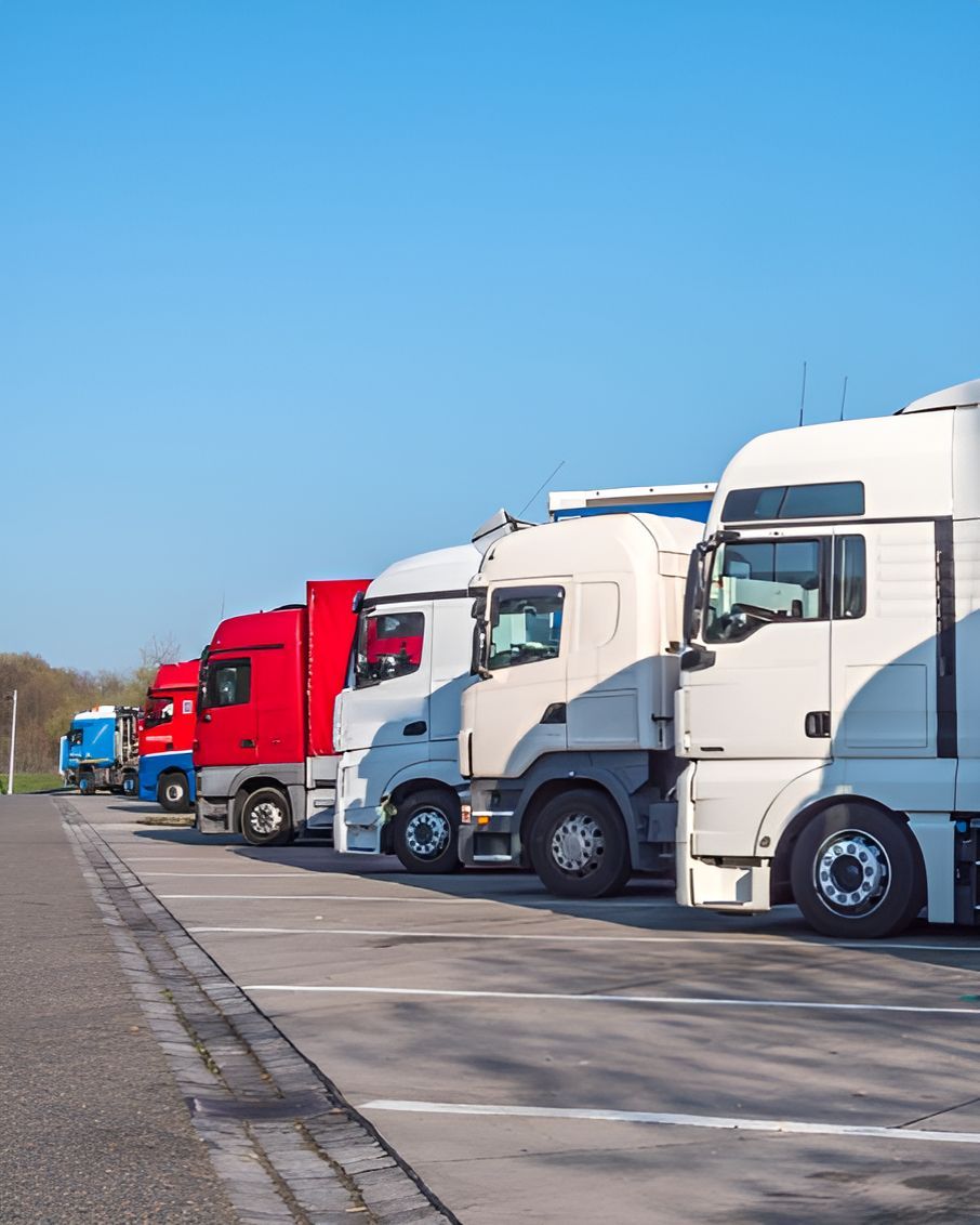 A Row of Semi Trucks Parked in a Parking Lot — Central Coast Storage Solutions in Erina, NSW