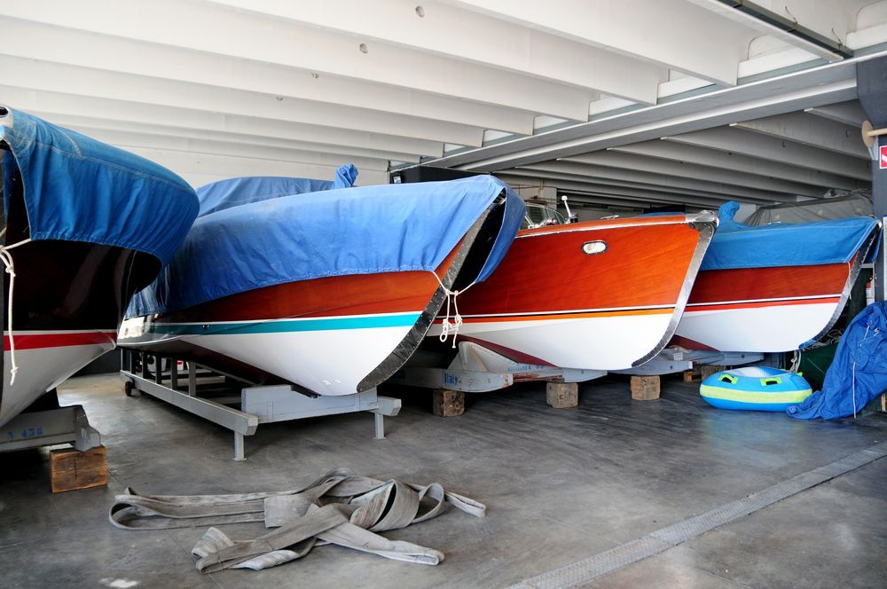 A Row of Boats Are Lined Up in a Warehouse — Central Coast Storage Solutions in Umina, NSW