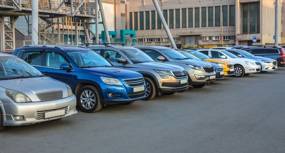 A Row of Cars Are Parked in a Parking Lot in Front of a Building — Central Coast Storage Solutions in Wamberal, NSW