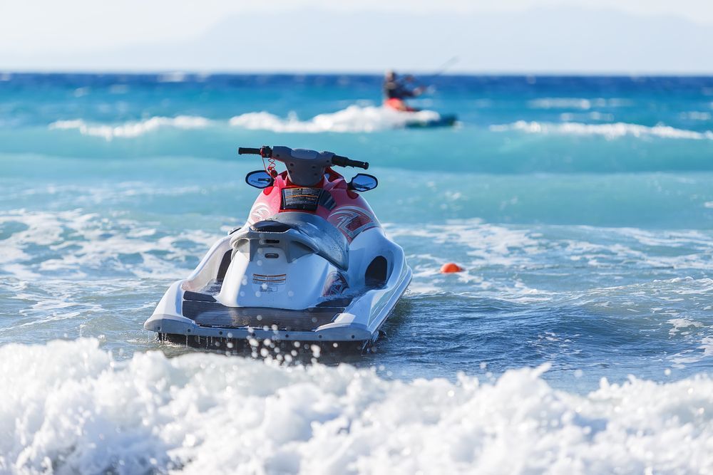 A Person is Riding a Jet Ski in the Ocean — Central Coast Storage Solutions in West Gosford, NSW