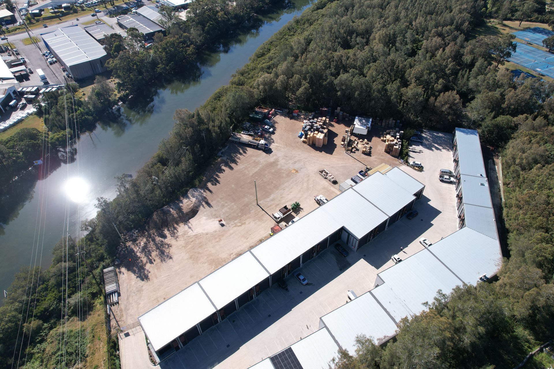 A Row of Trailers Parked Next to Each Other on A Lush Green Field — Central Coast Storage Solutions in West Gosford, NSW