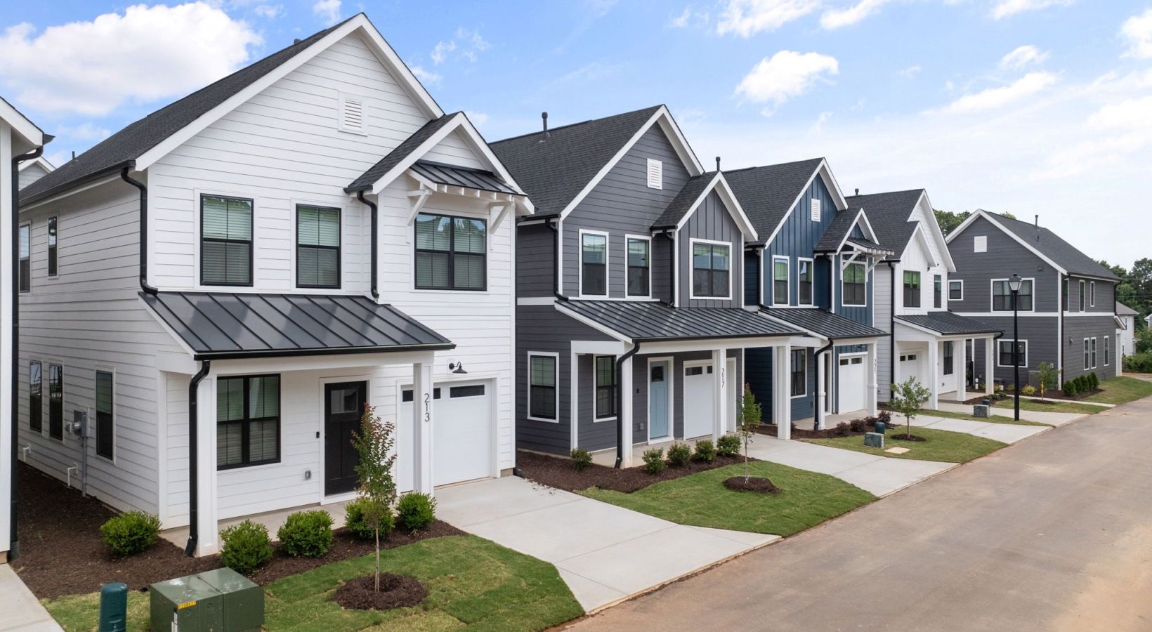 an artist 's impression of a row of houses in a residential neighborhood .
