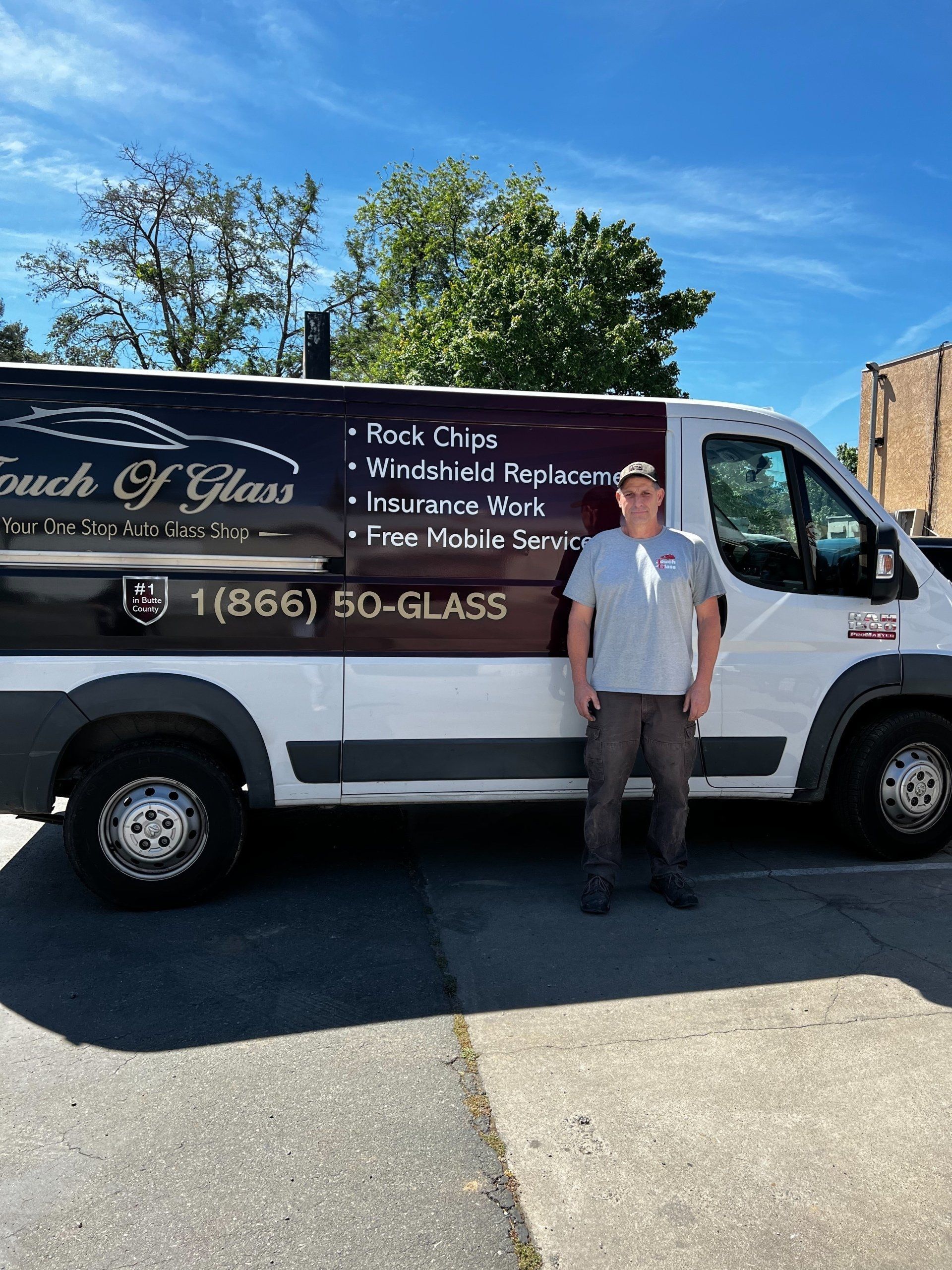 Man stands next to a white van with the 