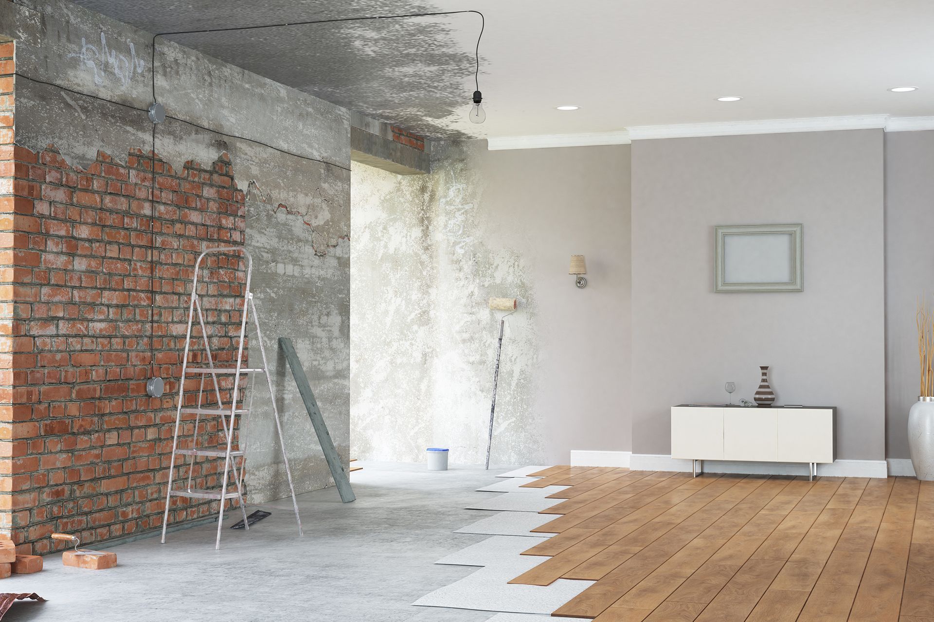 Half-finished with exposed brick and concrete, other half complete with wood floor and finished walls.