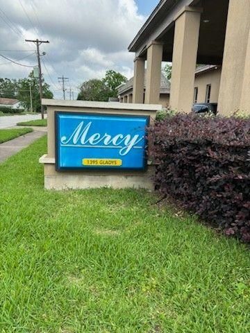 A blue and yellow sign reading