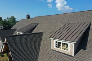 An aerial view of a roof with a window on it.