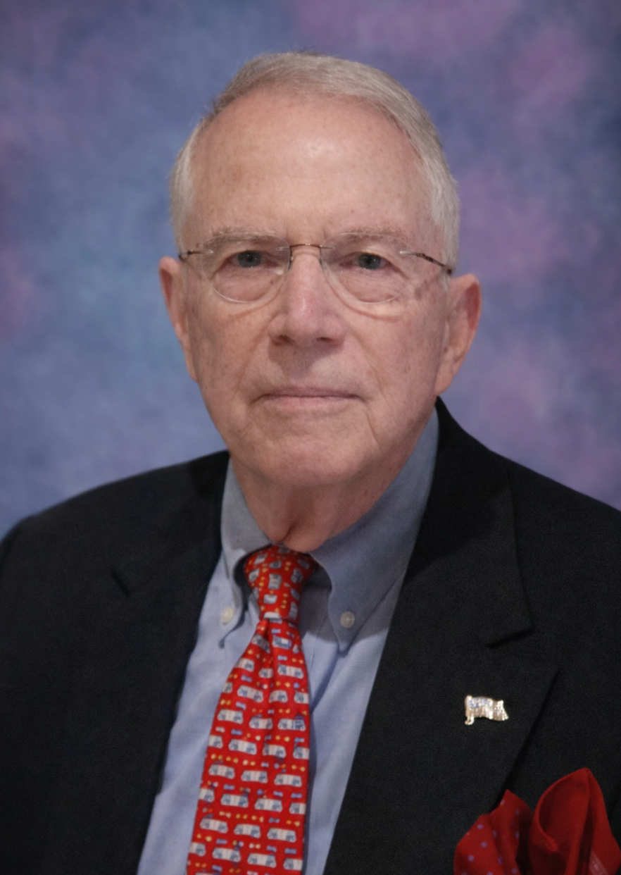 An older man with glasses