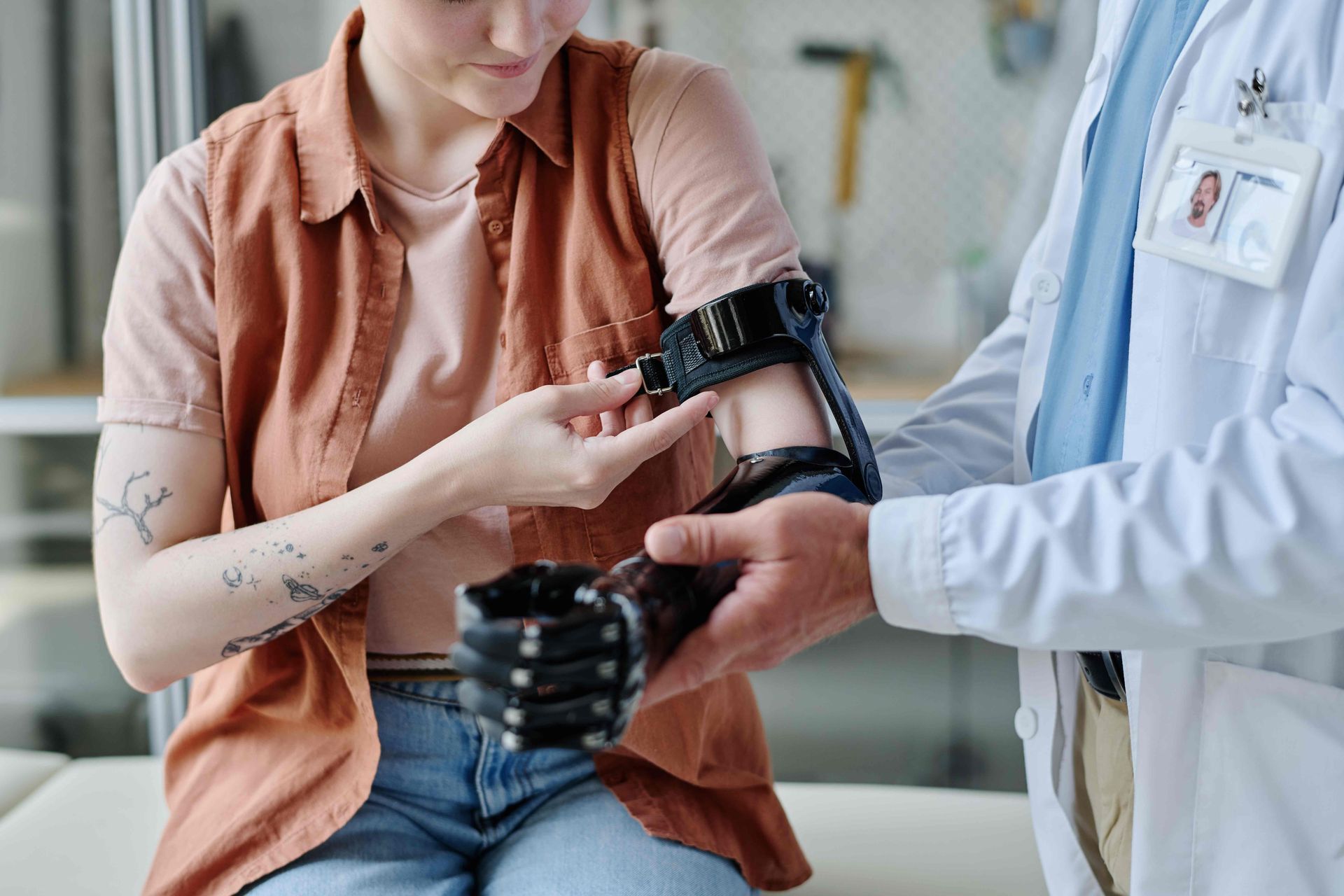 Woman being fitted with a prosthetic arm by doctor near Edgewood, KY, and Lawrenceburg, IN