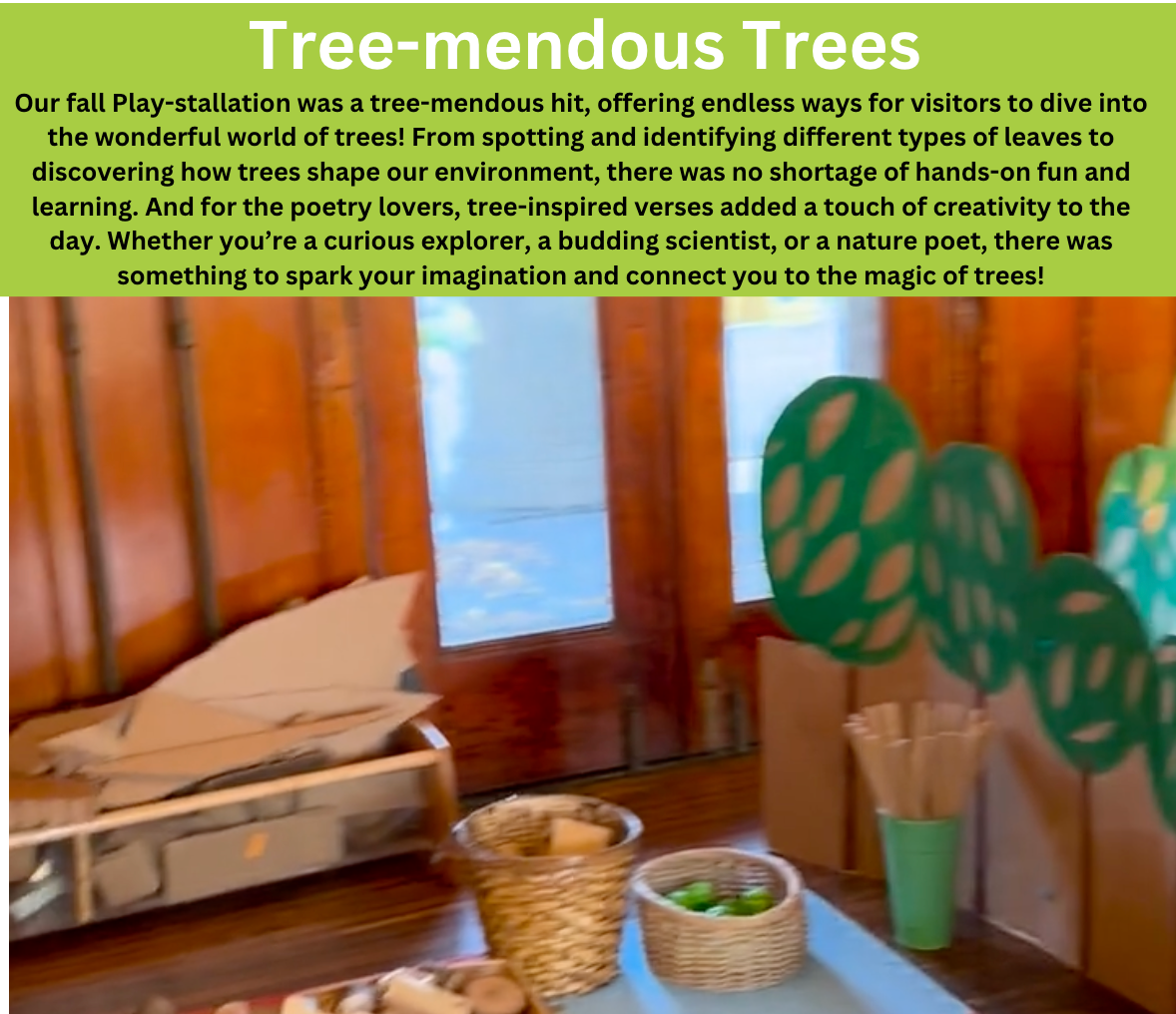 Tree-mendous Trees sign above a table with craft supplies and paper trees by a window
