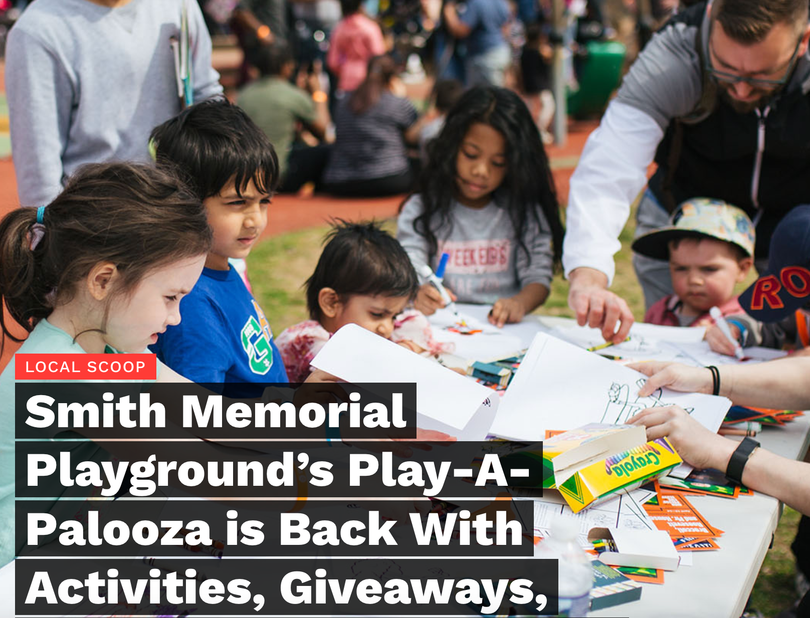 Children gather at a community playground giveaway table with toys, snacks, and activities.