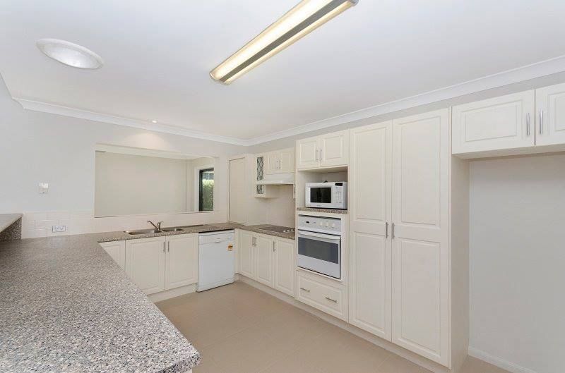 Cream-colored Kitchen With Appliances, Cabinets, and a Granite Countertop — George Pappas Painting In Buderim, QLD
