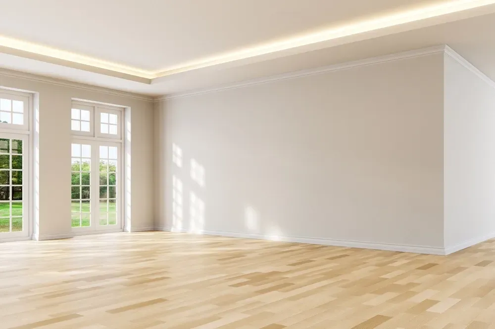 Empty room with light-colored hardwood floors, white walls, and large windows looking out onto a green landscape. — George Pappas Painting In Buderim, QLD