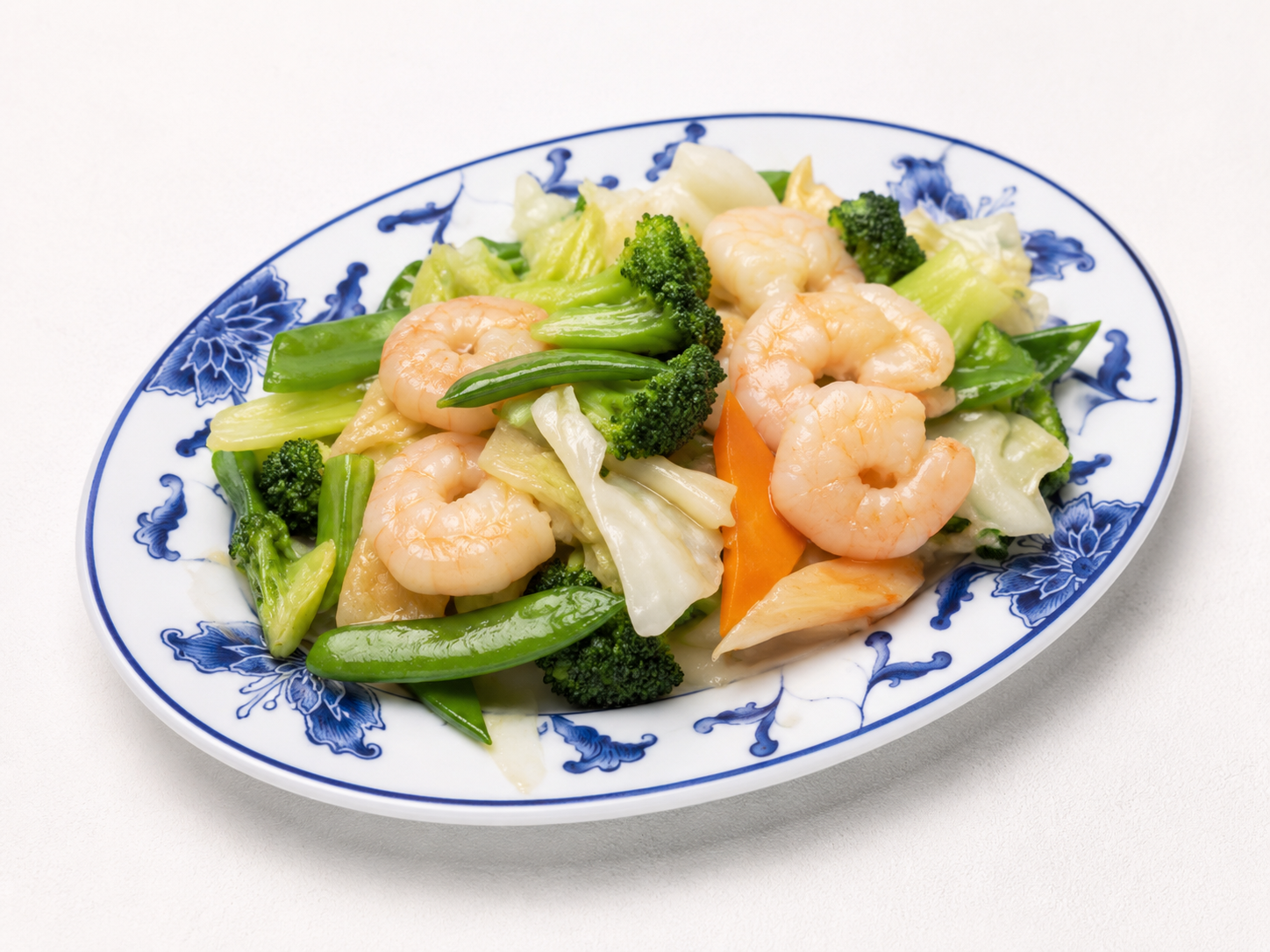 Shrimp and broccoli stir-fry on a blue-and-white patterned plate